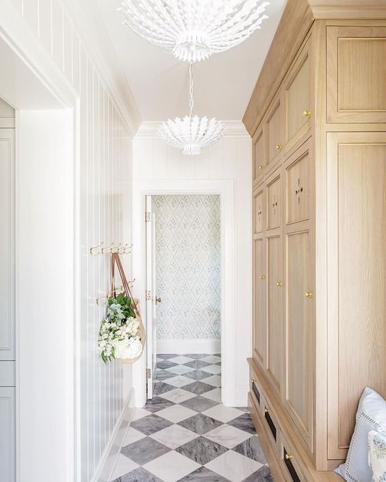 A white colored hallway with a wardrobe to the right