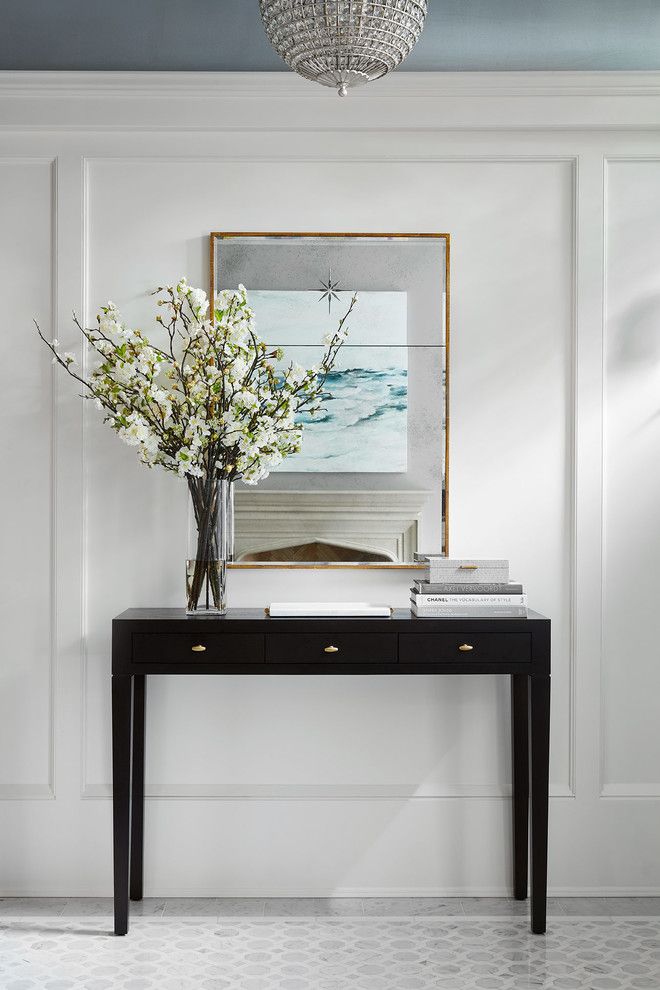 A vase of flowers on a table - Peacock and Owl Interior Design