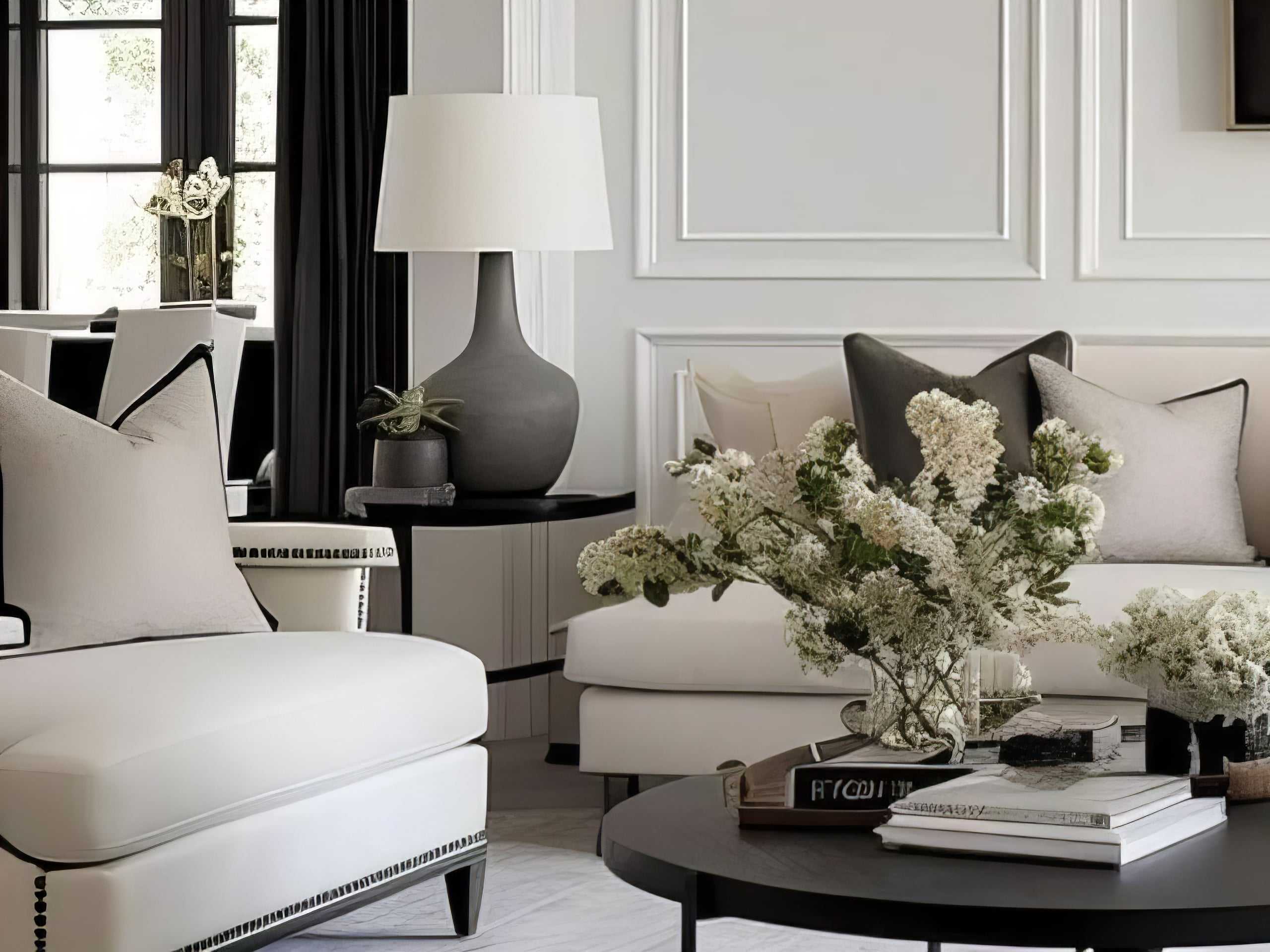 A white couch with white flowers in a living room interior design